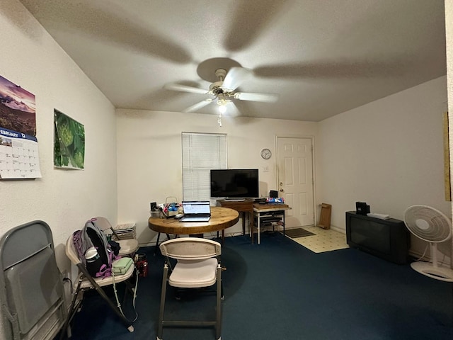 office area with a textured ceiling and ceiling fan