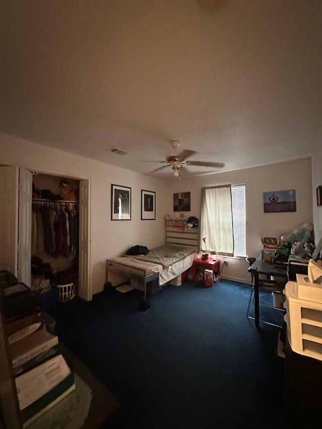 bedroom featuring carpet flooring, ceiling fan, and a closet