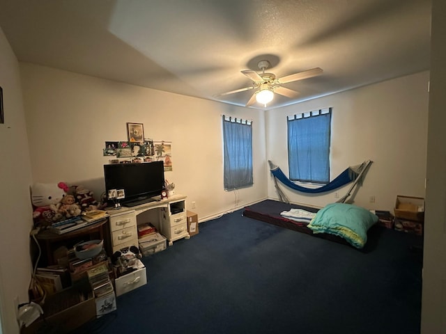 carpeted bedroom with ceiling fan