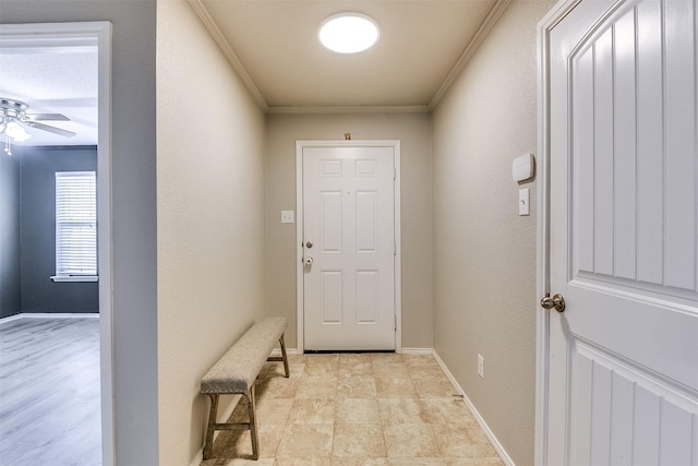 doorway to outside with ceiling fan and ornamental molding