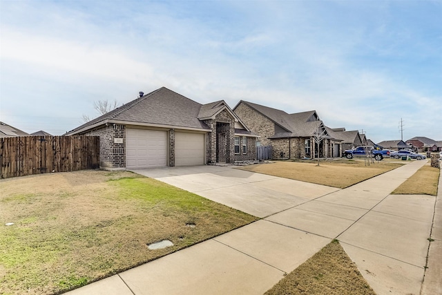 view of front facade featuring a garage and a front yard