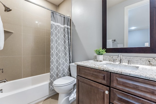 full bathroom featuring shower / bath combo, vanity, and toilet