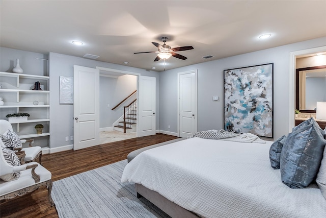 bedroom with wood-type flooring and ceiling fan