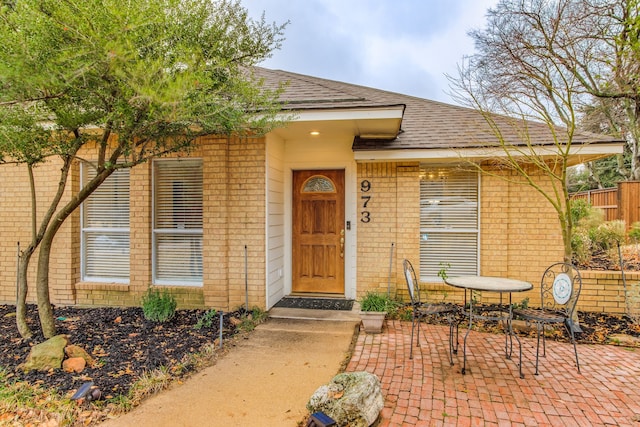 entrance to property featuring a patio area