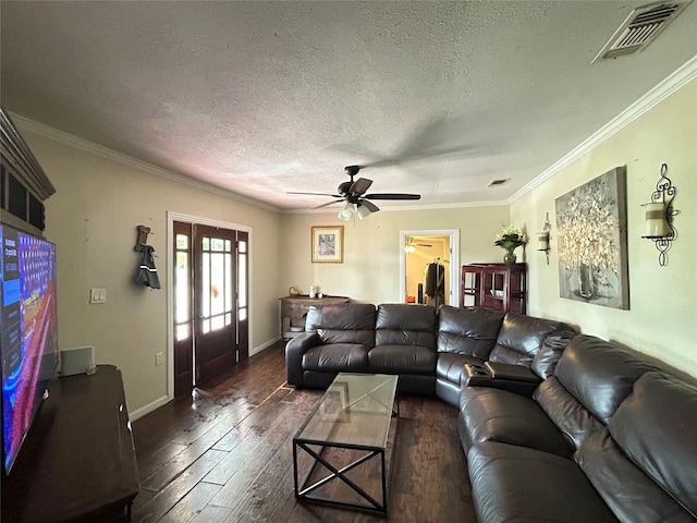 1321 Hall St, Lancaster, TX 75134 - living room with dark wood finished floors, a textured ceiling, ornamental molding, a ceiling fan, and baseboards