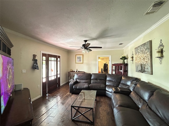 1321 Hall St, Lancaster, TX 75134 - living room featuring a textured ceiling, dark wood-type flooring, crown molding, a ceiling fan, and french doors