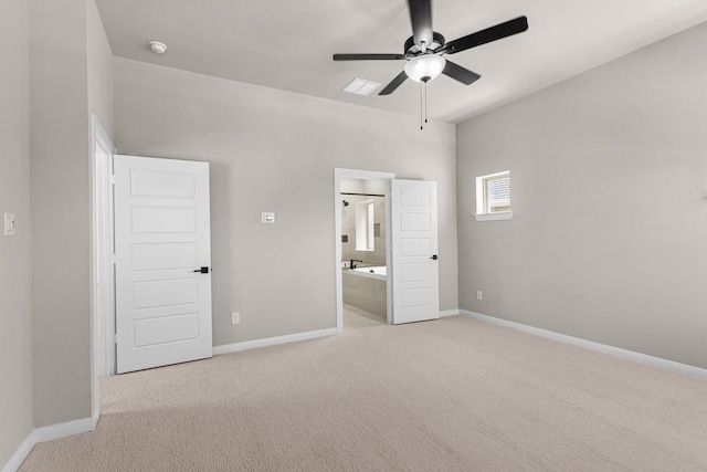 unfurnished bedroom featuring carpet floors, baseboards, ceiling fan, and ensuite bath