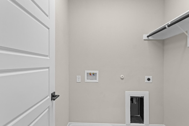 clothes washing area with laundry area, hookup for a washing machine, hookup for an electric dryer, hookup for a gas dryer, and baseboards
