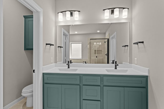 full bathroom with a shower stall, double vanity, a sink, and toilet