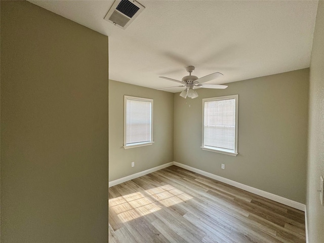 unfurnished room featuring ceiling fan and light hardwood / wood-style floors