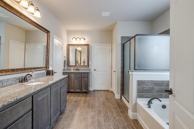 bathroom with vanity and plus walk in shower