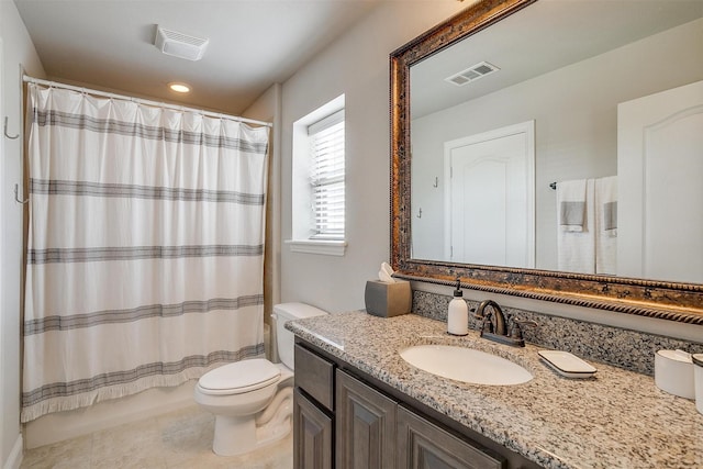 bathroom featuring walk in shower, vanity, toilet, and tile patterned flooring