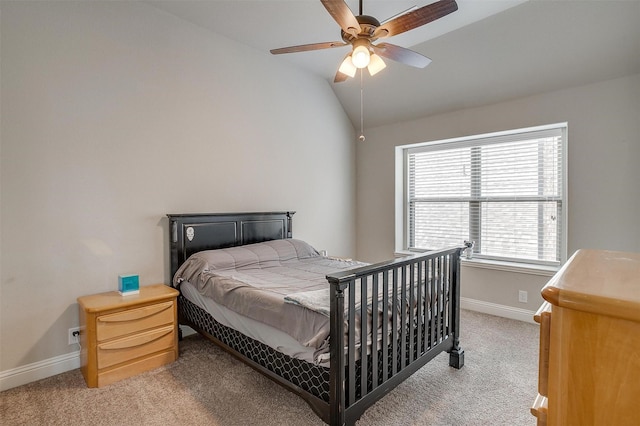 carpeted bedroom with vaulted ceiling and ceiling fan