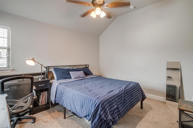 bedroom with ceiling fan, light colored carpet, and lofted ceiling