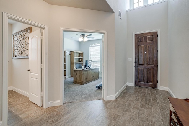 entrance foyer featuring ceiling fan and light hardwood / wood-style flooring