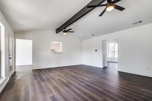 spare room with vaulted ceiling with beams, visible vents, dark wood finished floors, and a ceiling fan