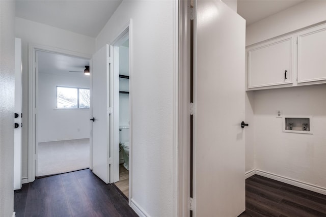 clothes washing area with laundry area, hookup for a washing machine, dark wood finished floors, and baseboards