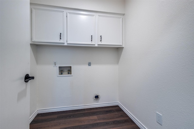 clothes washing area featuring dark wood-style floors, cabinet space, hookup for a washing machine, and electric dryer hookup