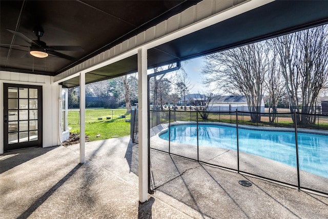 view of swimming pool with a fenced in pool, a patio, a lawn, a ceiling fan, and fence