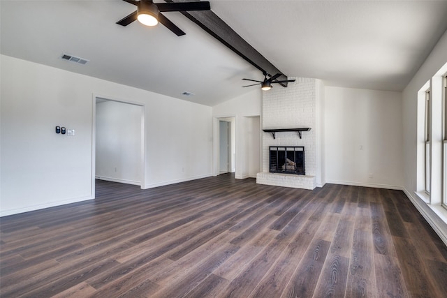 unfurnished living room with vaulted ceiling with beams, dark wood-type flooring, visible vents, baseboards, and a brick fireplace