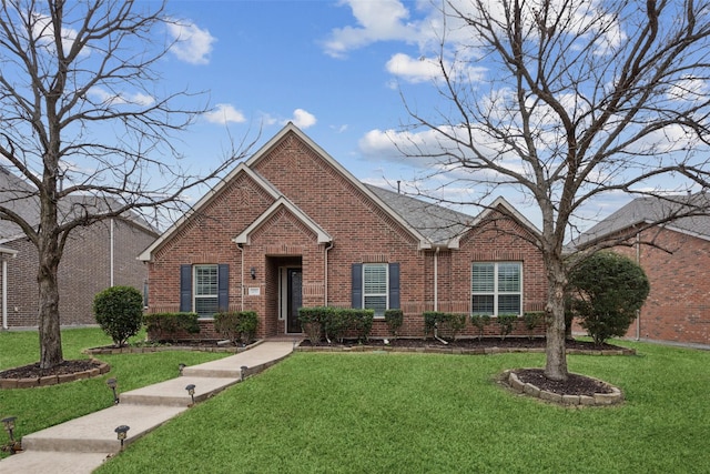 view of front of home with a front lawn