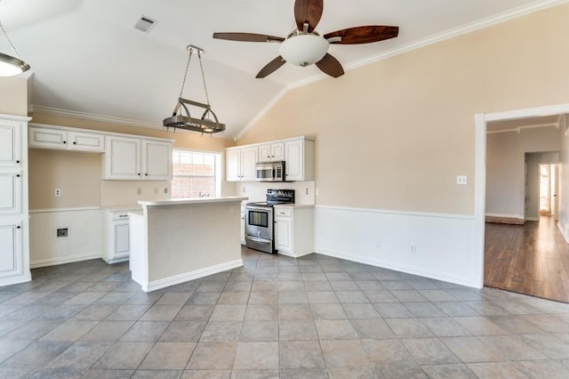 kitchen with visible vents, white cabinetry, stainless steel appliances, and light countertops