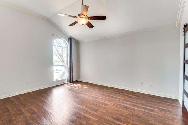 unfurnished room with baseboards, a ceiling fan, lofted ceiling, ornamental molding, and dark wood-type flooring