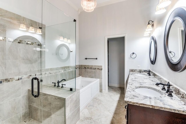 bathroom featuring crown molding, a sink, a bath, and a shower stall