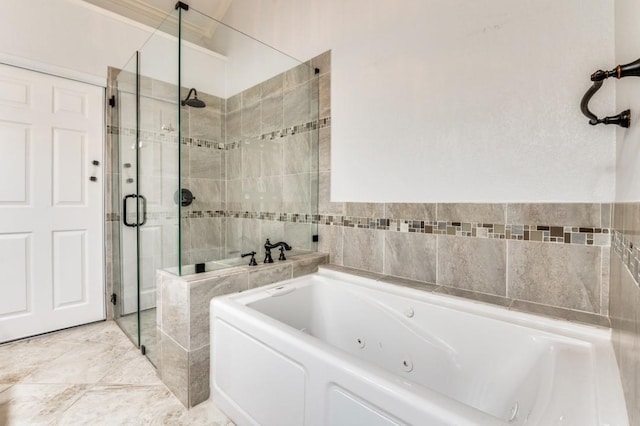 bathroom featuring a stall shower and a whirlpool tub