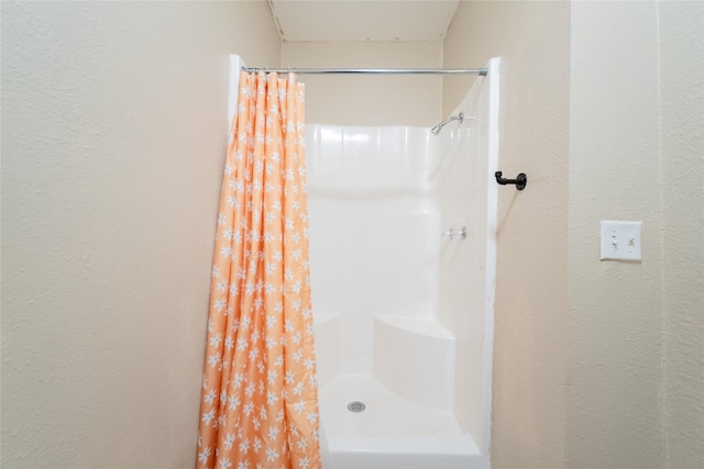 bathroom featuring walk in shower