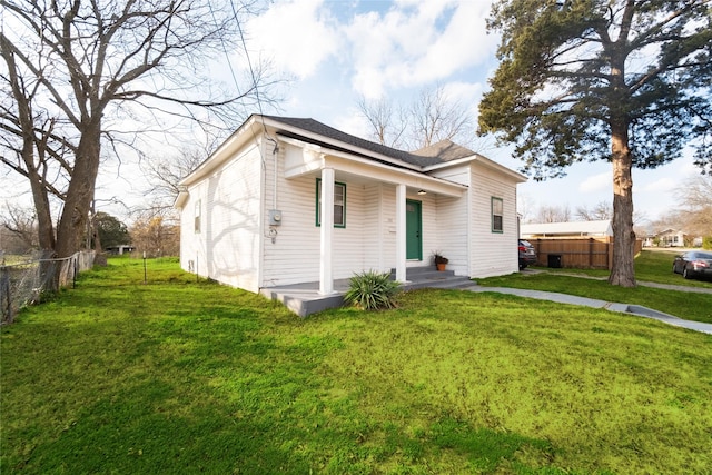 view of front of home featuring a porch and a front lawn