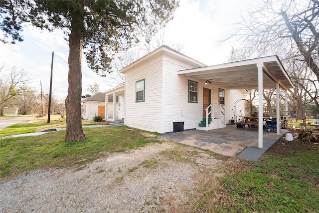 view of side of property with a yard