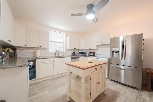 kitchen featuring white cabinetry and appliances with stainless steel finishes