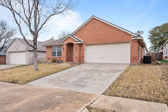 single story home with central AC, a front lawn, and a garage