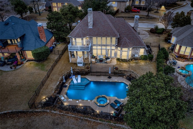 back of house with a balcony