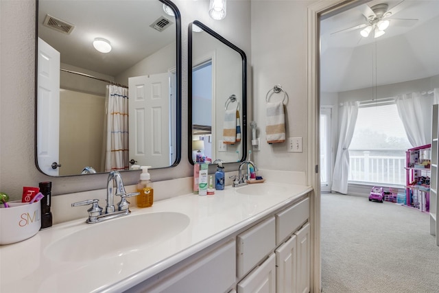 bathroom with vanity, lofted ceiling, and ceiling fan