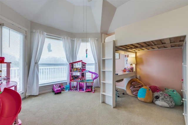 playroom with vaulted ceiling and carpet