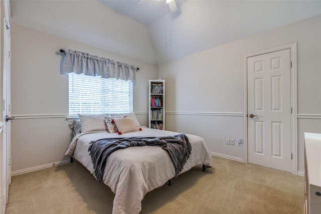 carpeted bedroom with lofted ceiling and ceiling fan