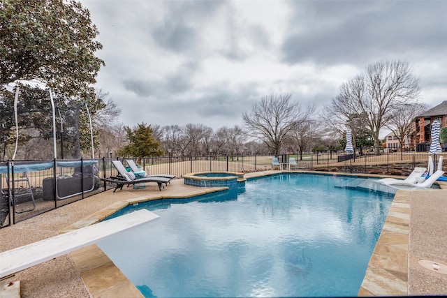 view of pool featuring an in ground hot tub and a patio area