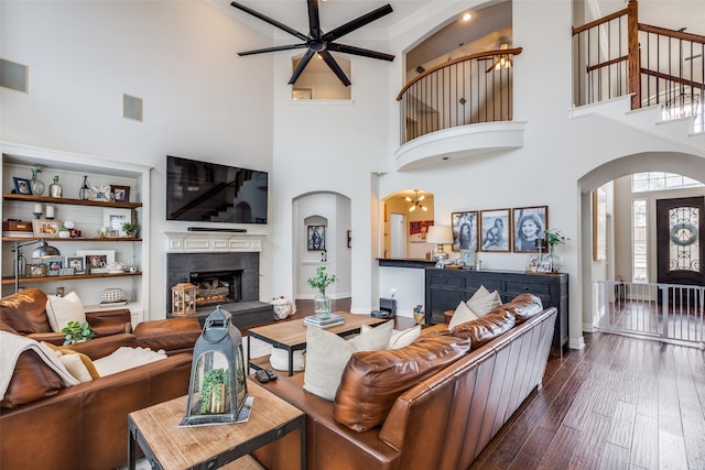 living room featuring dark hardwood / wood-style floors and ceiling fan