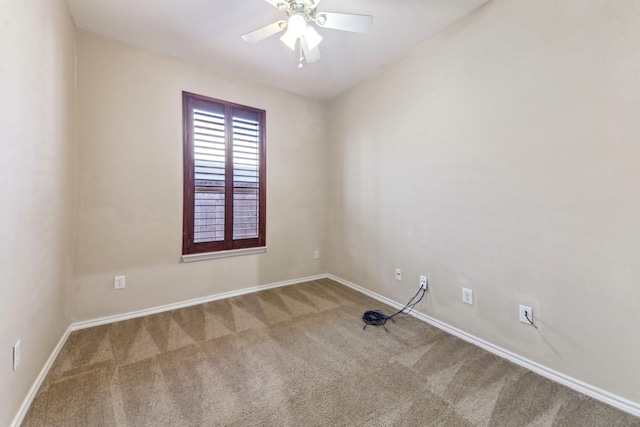 spare room featuring ceiling fan and carpet flooring