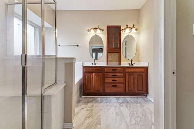 bathroom with vanity and a shower with door