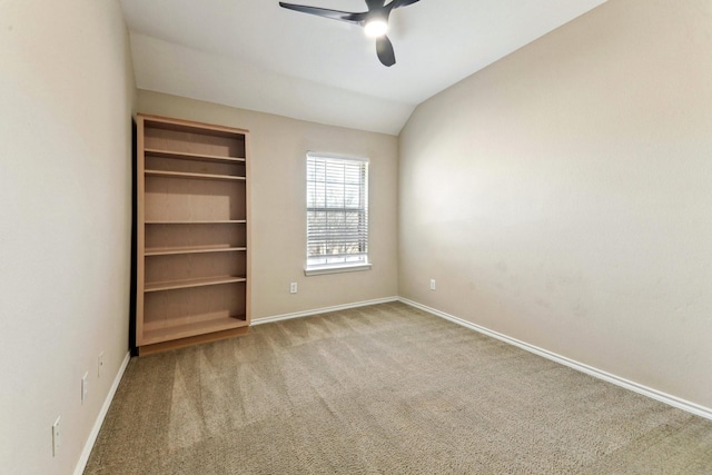 unfurnished bedroom with ceiling fan, carpet flooring, vaulted ceiling, and a closet