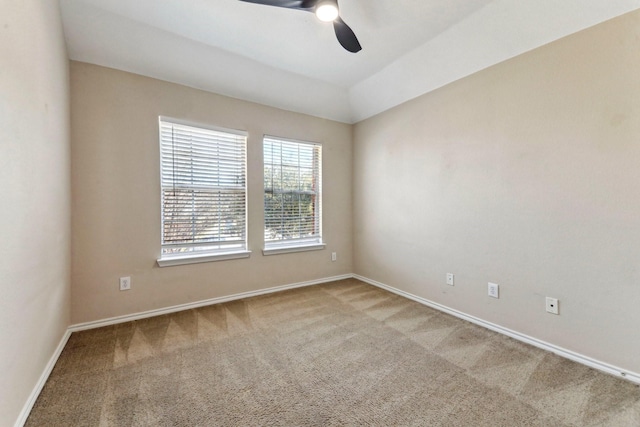 spare room with carpet floors and ceiling fan