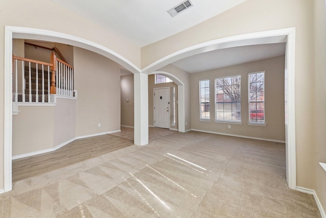 foyer with light colored carpet