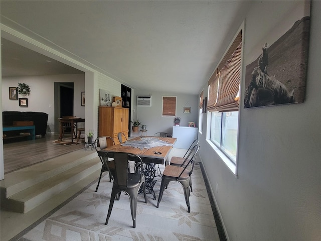 dining room featuring a wall unit AC