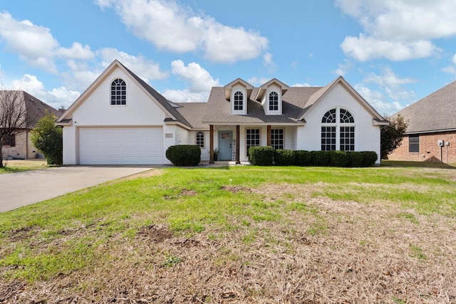 view of front of home featuring a garage and a front yard