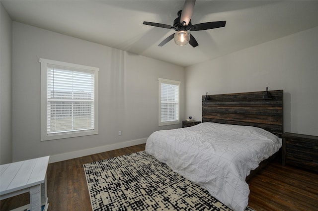 bedroom featuring dark hardwood / wood-style floors and ceiling fan