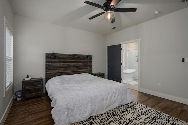 bedroom featuring ceiling fan, connected bathroom, and dark hardwood / wood-style flooring