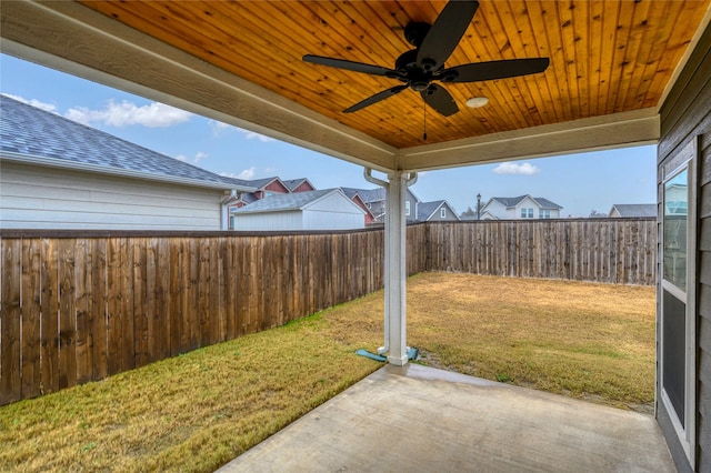 view of yard with a patio area and ceiling fan